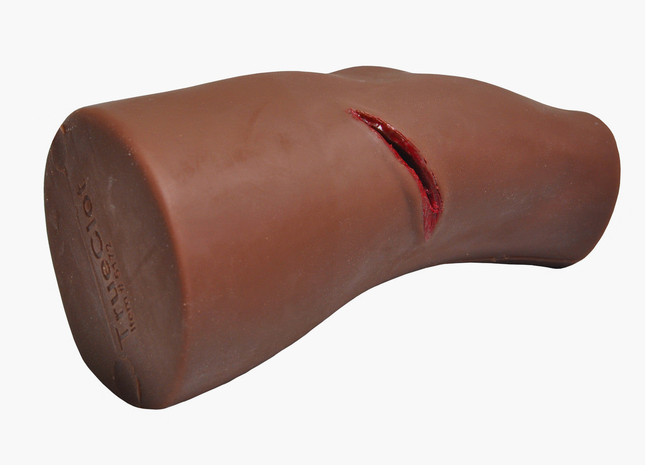Dark Tone PCT3 Leg Trainer by TrueClot with gauze stuffed in knife wound