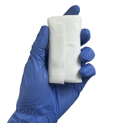 QuikClot® Bleeding Control Dressing, in hand