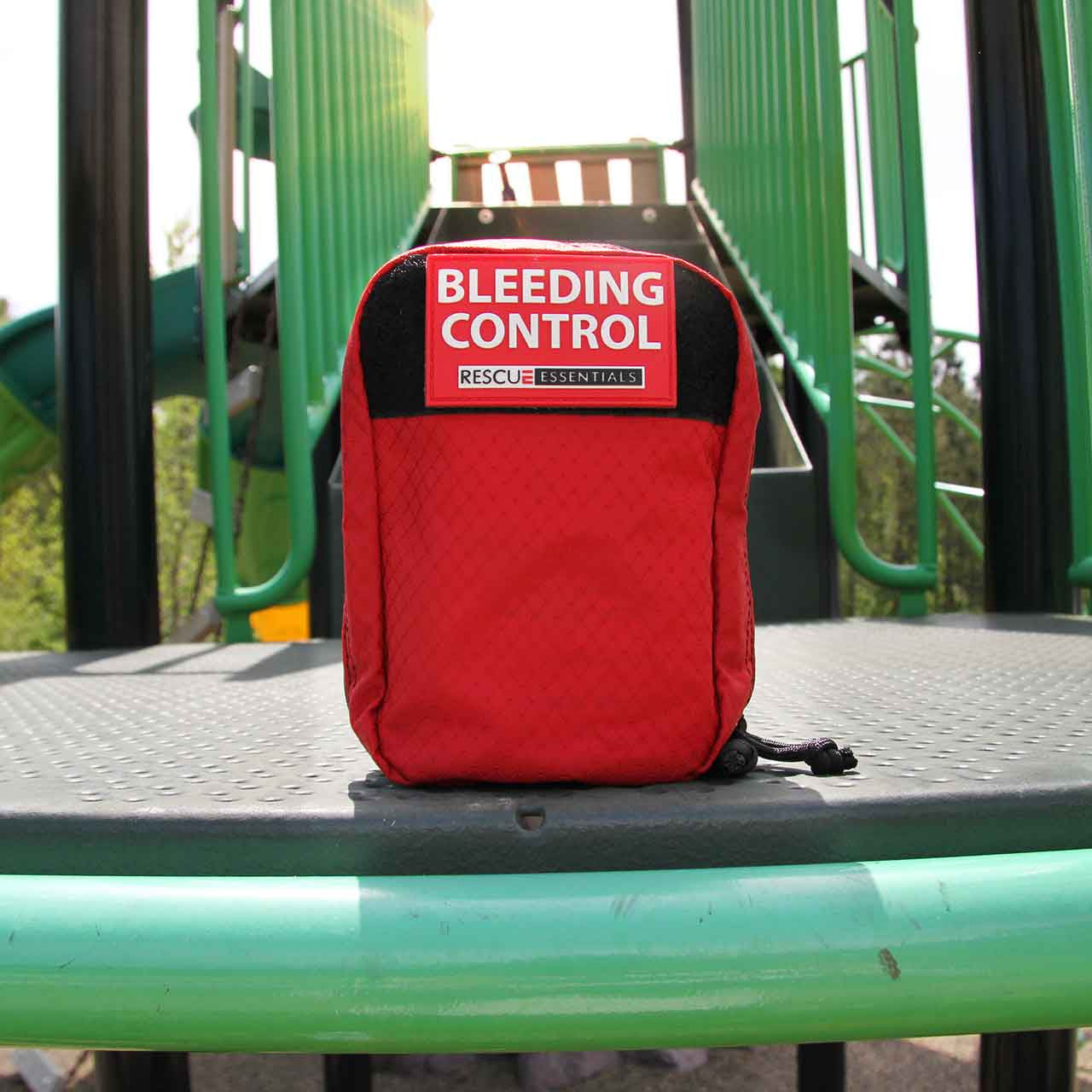 Rescue Essentials Bleeding Control Station IFAK (Individual) shown on playground equipment