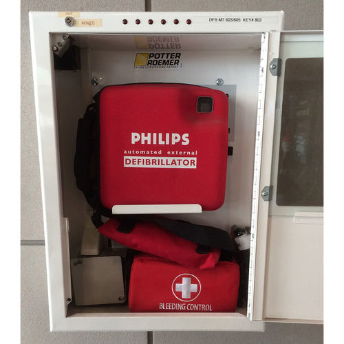 Stop The Bleed - Dual Treatment Kit by rescue essentials shown inside an AED box